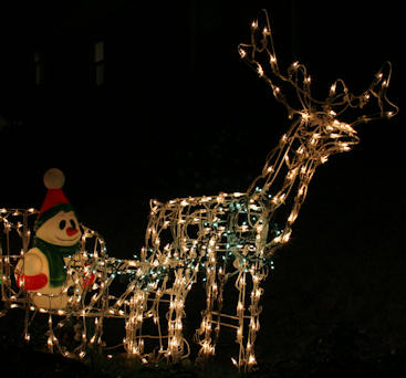 Reindeer and sleigh with snowman